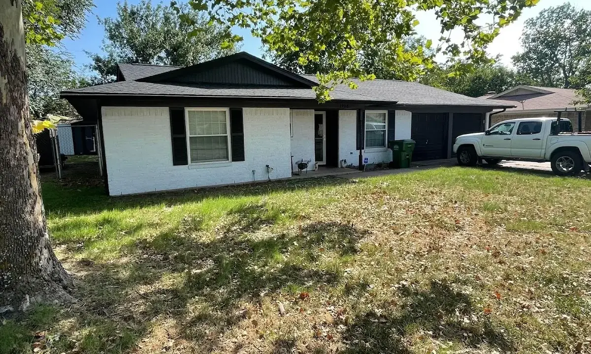 Professional roofing crew working on a residential roof in Fort Leonard Wood